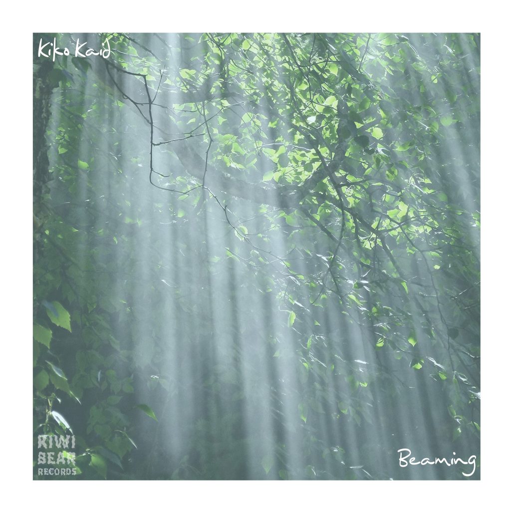Artwork for the lofi hip-hop single Beaming from producer Kiko Kaid. Featuring green trees with sun beams shining through the haze.